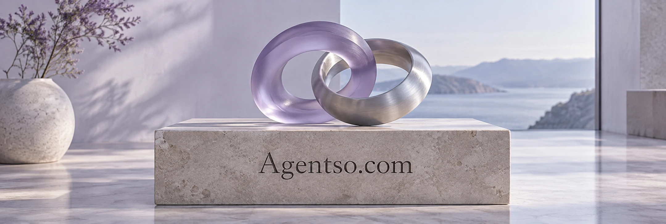 Linked violet glass and brushed metal forms on a plinth bearing Agentso.com